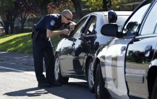 The Real Reason Officers Tap Your Tail Light At A Traffic Stop