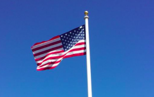 Fire Department Helps Raise Flag for War Widow