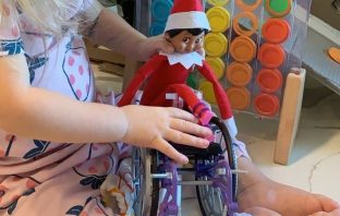 Mom Creates Elf On The Shelf In A Wheelchair For Daughter With A Rare Genetic Disease